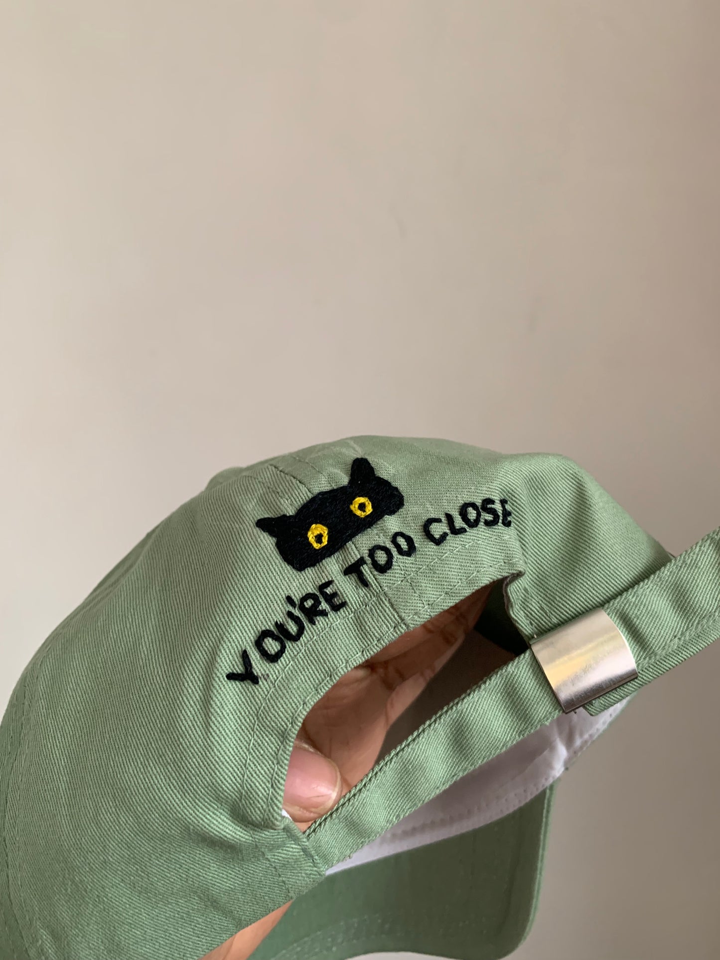 “You’re too close” Cap